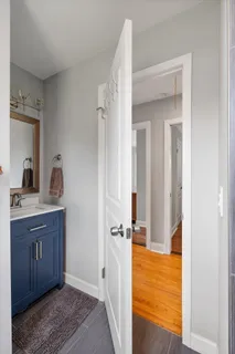 a view of room with window and wooden floor