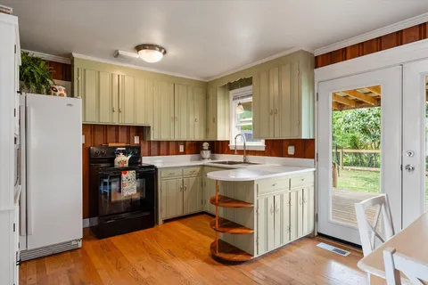 a kitchen with a sink and a window