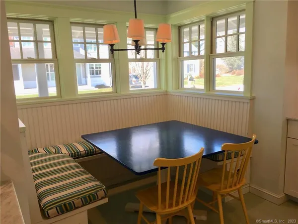 a view of a livingroom with furniture and windows