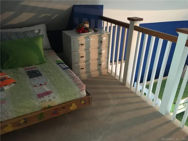 a utility room with furniture and stairs