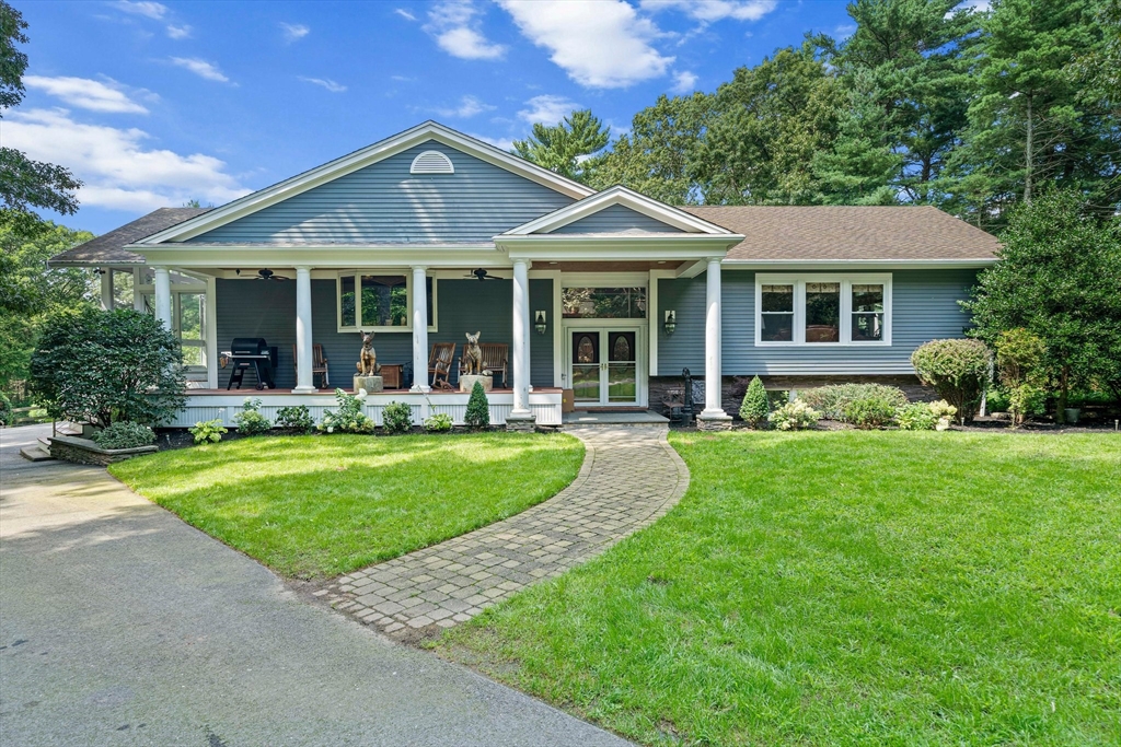 96 Deborah Road Hanover, MA 02339 - Photo 1 of 41 a front view of a house with a yard table and chairs