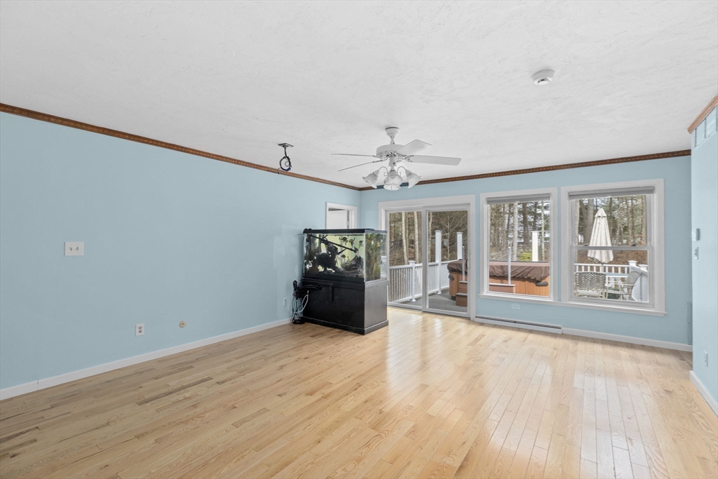 96 Deborah Road Hanover, MA 02339 - Photo 24 of 41 a view of an empty room with wooden floor and a window