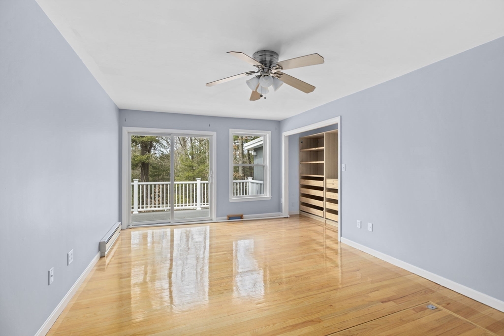 96 Deborah Road Hanover, MA 02339 - Photo 30 of 41 a view of an empty room with a window and wooden floor