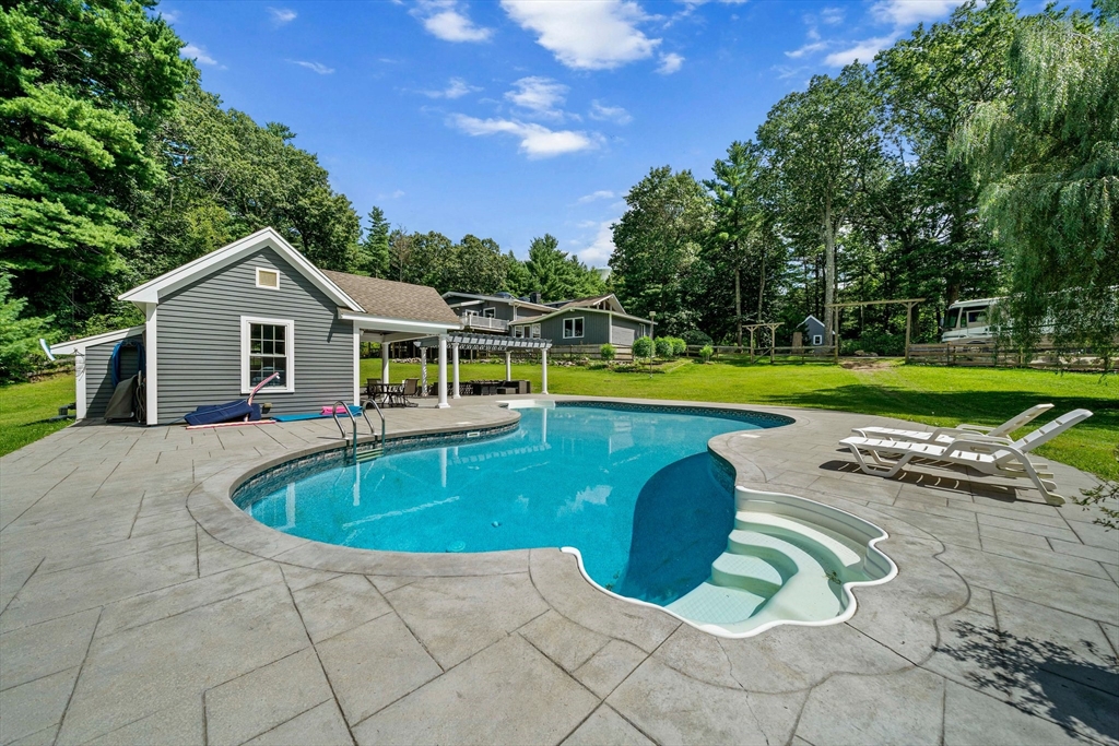 96 Deborah Road Hanover, MA 02339 - Photo 3 of 41 a view of a house with a swimming pool and a yard