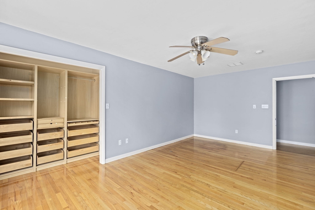 96 Deborah Road Hanover, MA 02339 - Photo 31 of 41 a view of a room with wooden floor and ceiling fan