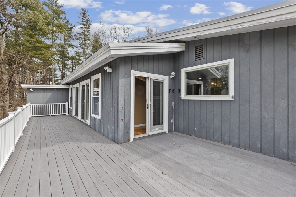 96 Deborah Road Hanover, MA 02339 - Photo 34 of 41 a view of backyard with a deck and wooden floor
