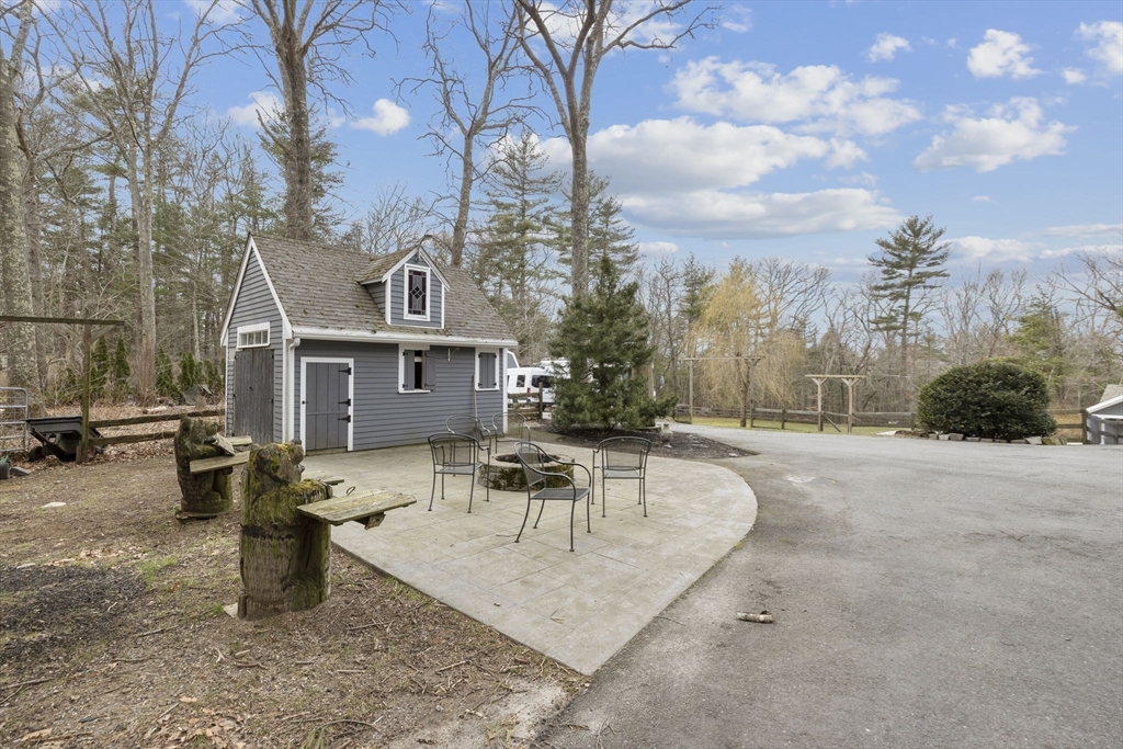 96 Deborah Road Hanover, MA 02339 - Photo 41 of 41 a front view of a house with garden and sitting area