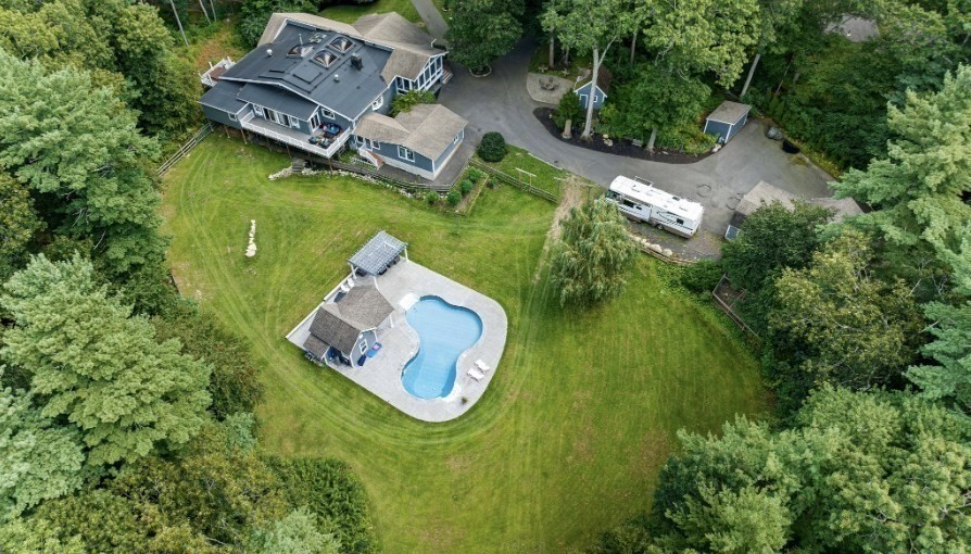 96 Deborah Road Hanover, MA 02339 - Photo 6 of 41 an aerial view of a house with a swimming pool and garden
