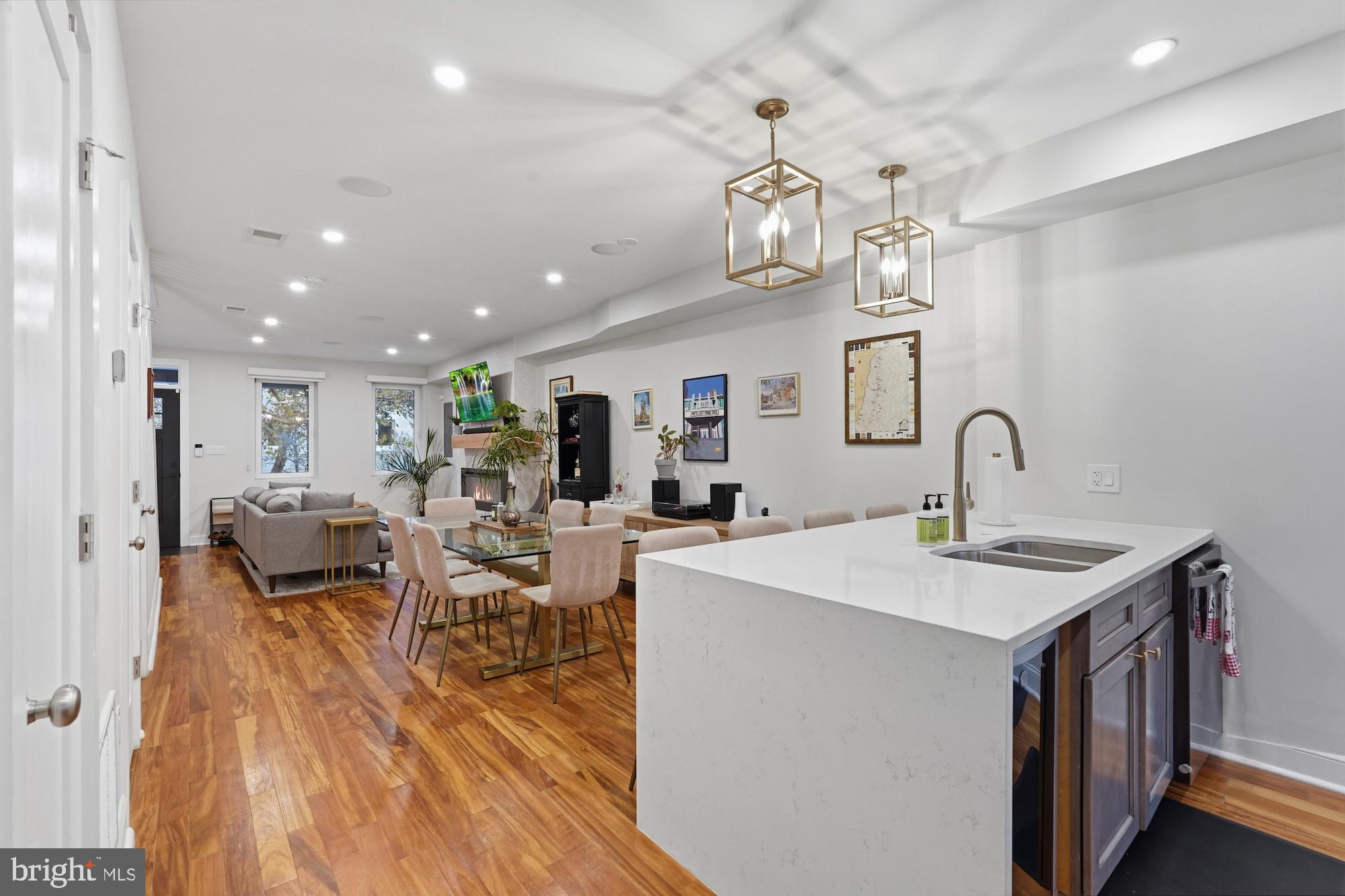 331 W Street Northeast Washington, DC 20002 - Photo 11 of 25 a view of a dining room and livingroom with furniture wooden floor a chandelier