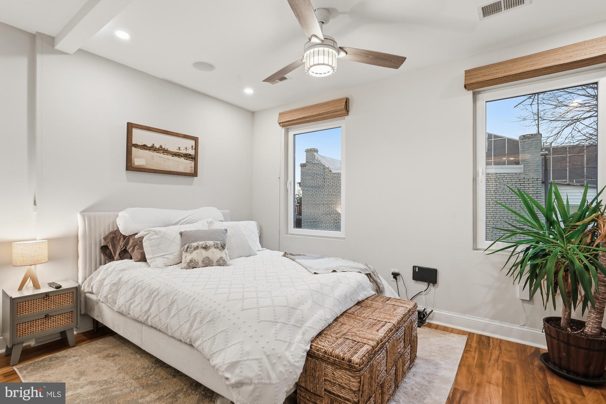 331 W Street Northeast Washington, DC 20002 - Photo 18 of 25 a bedroom with bed and a potted plant