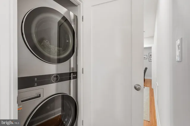 a close view of utility and utility room with washer and dryer