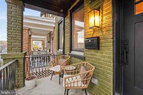 a view of balcony with furniture
