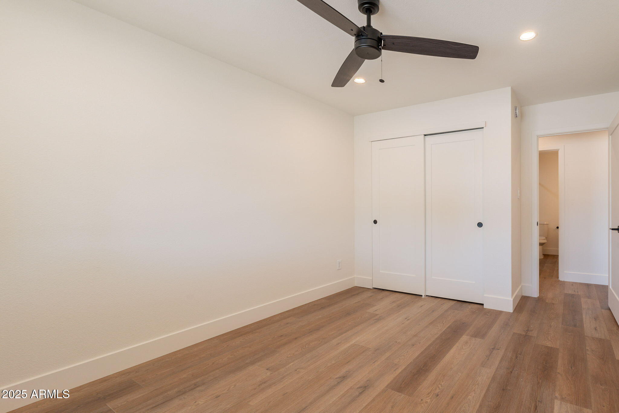 1530 East Alameda Drive Tempe, AZ 85282 - Photo 22 of 54 a view of a room with wooden floor