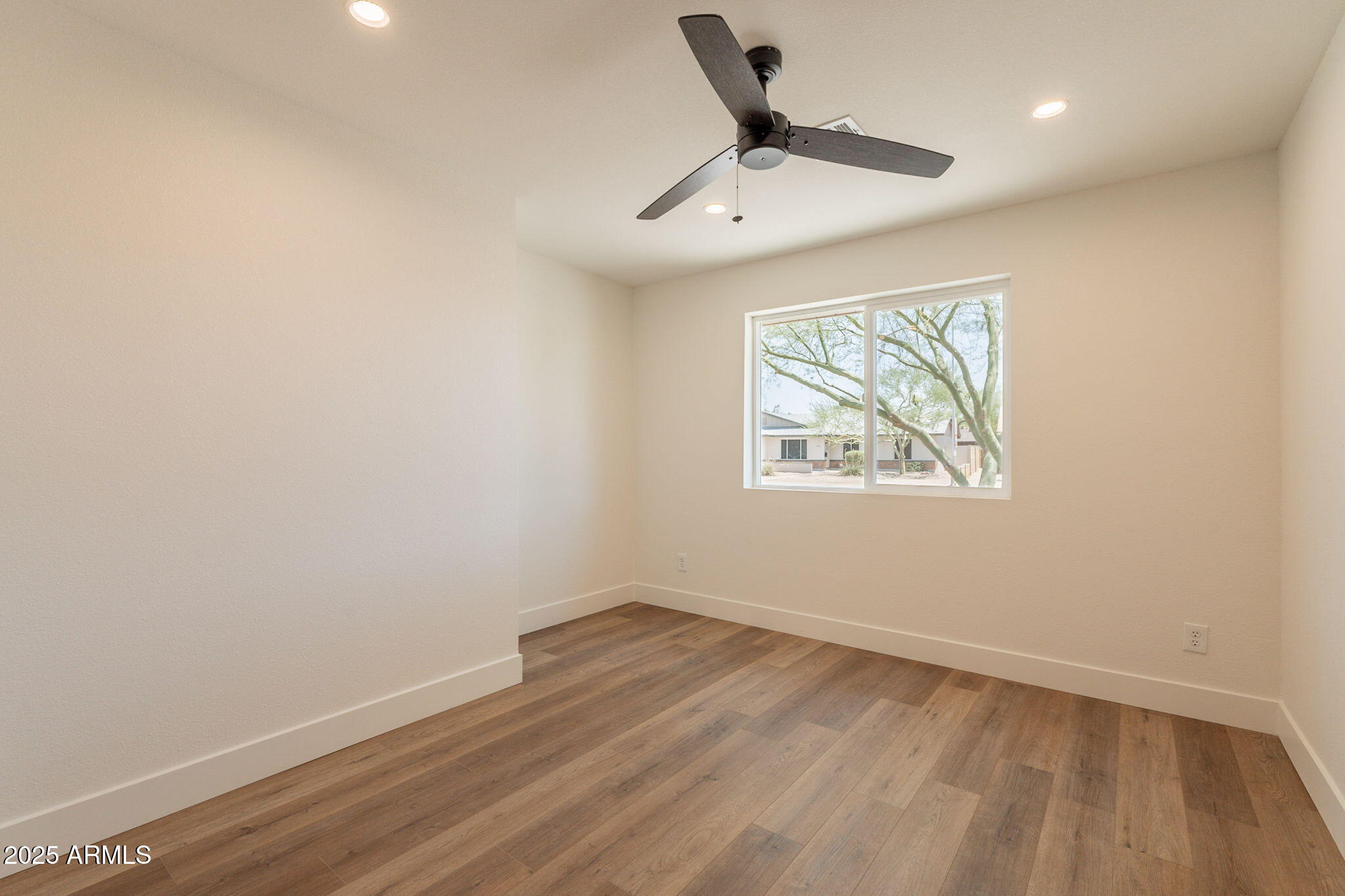 1530 East Alameda Drive Tempe, AZ 85282 - Photo 25 of 54 wooden floor in an empty room with a window