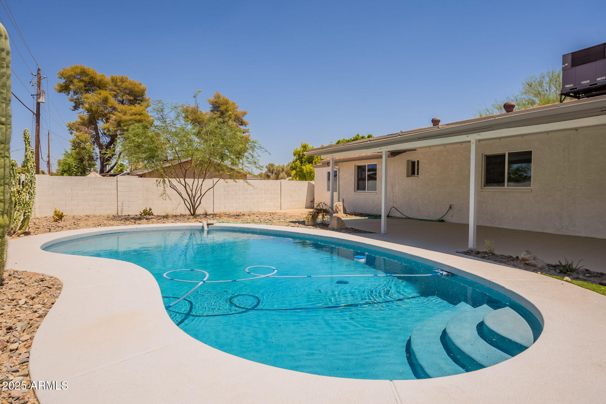 1530 East Alameda Drive Tempe, AZ 85282 - Photo 3 of 54 a view of a swimming pool with an outdoor seating