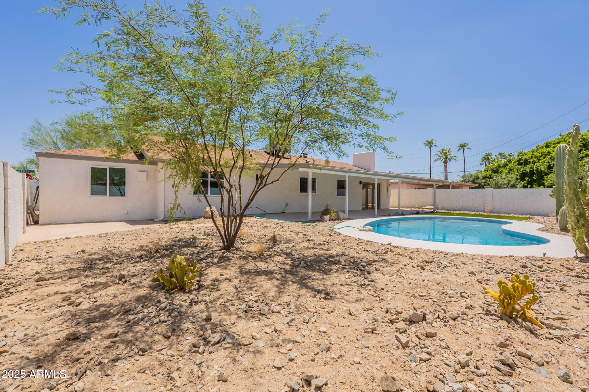 1530 East Alameda Drive Tempe, AZ 85282 - Photo 45 of 54 a backyard of a house with table and chairs