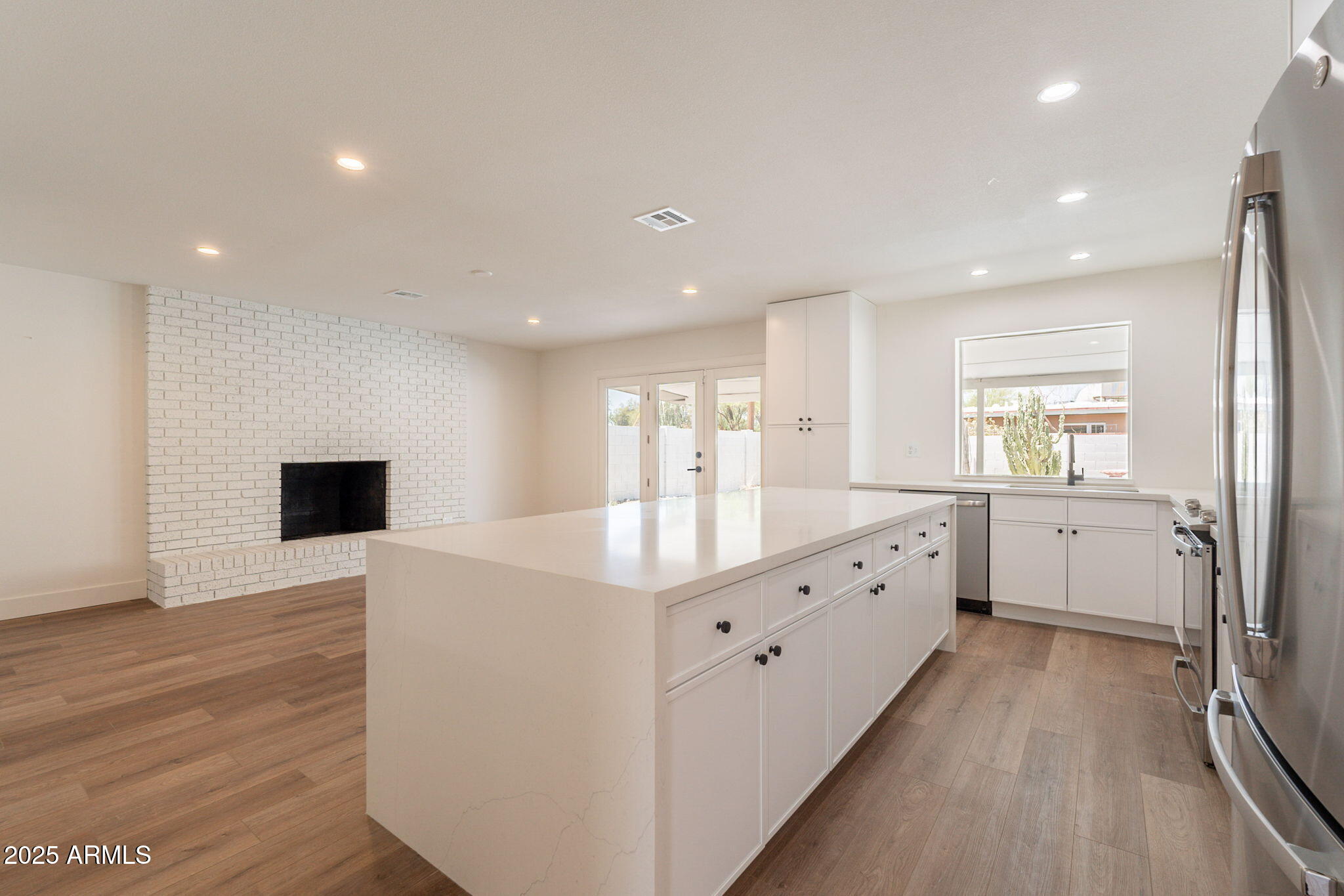 1530 East Alameda Drive Tempe, AZ 85282 - Photo 8 of 54 a large white room with stainless steel appliances lots of white cabinets