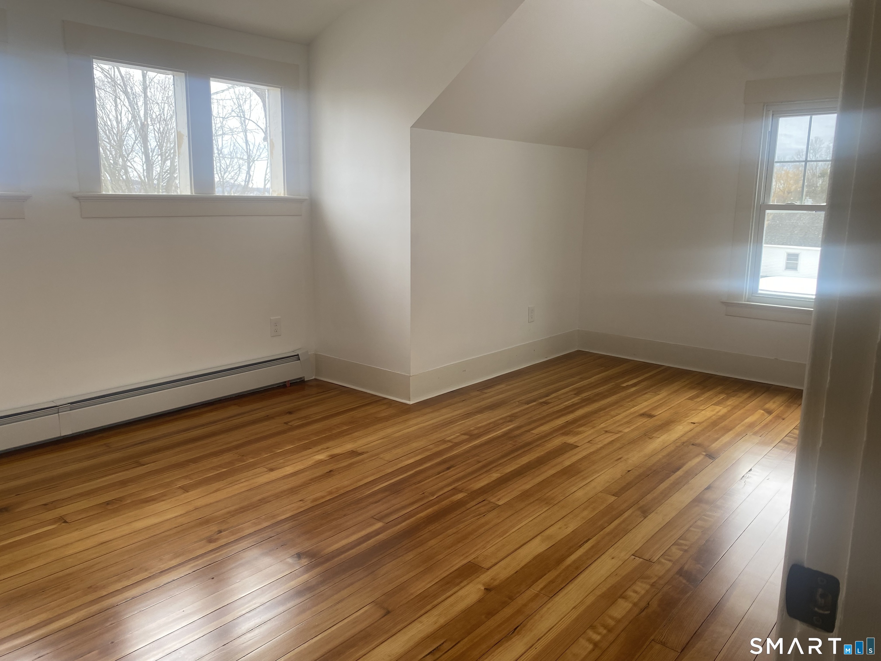 86 Foote Street Hamden, CT 06517 - Photo 7 of 14 wooden floor in an empty room with a window