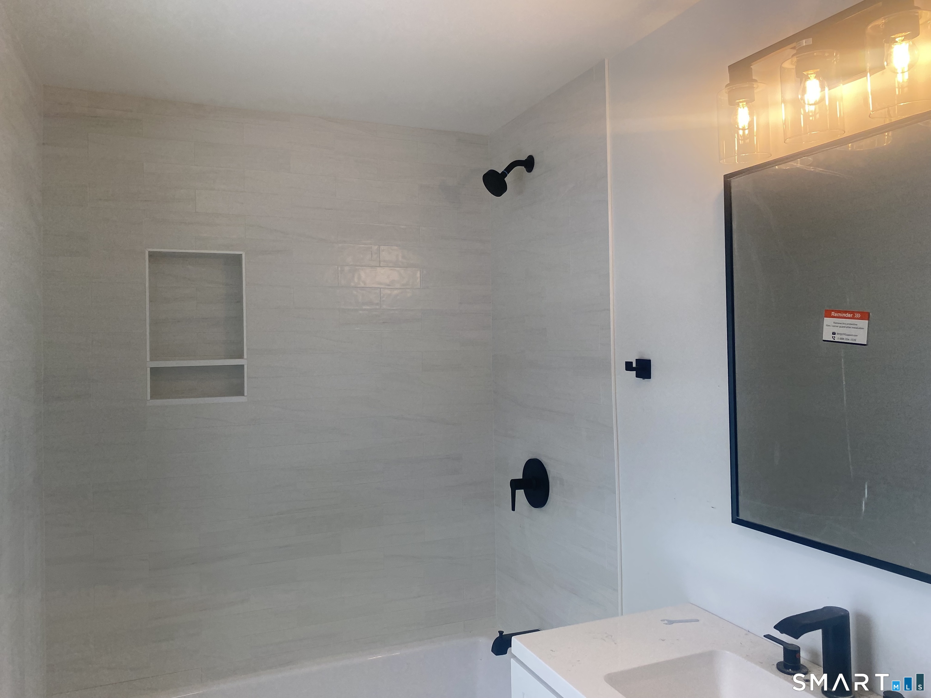 86 Foote Street Hamden, CT 06517 - Photo 9 of 14 a bathroom with a shower