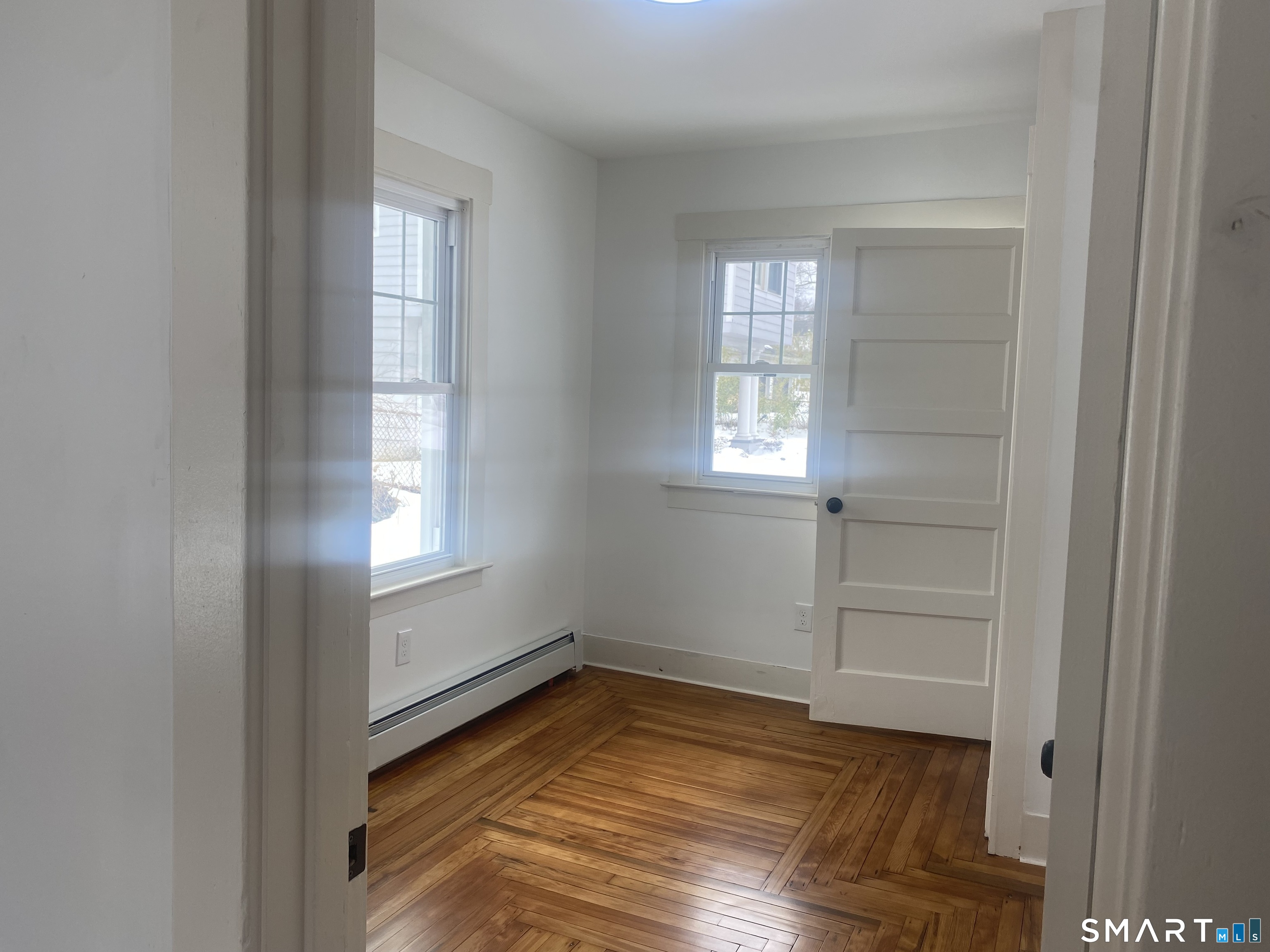 86 Foote Street Hamden, CT 06517 - Photo 10 of 14 a view of empty room with wooden floor and fan