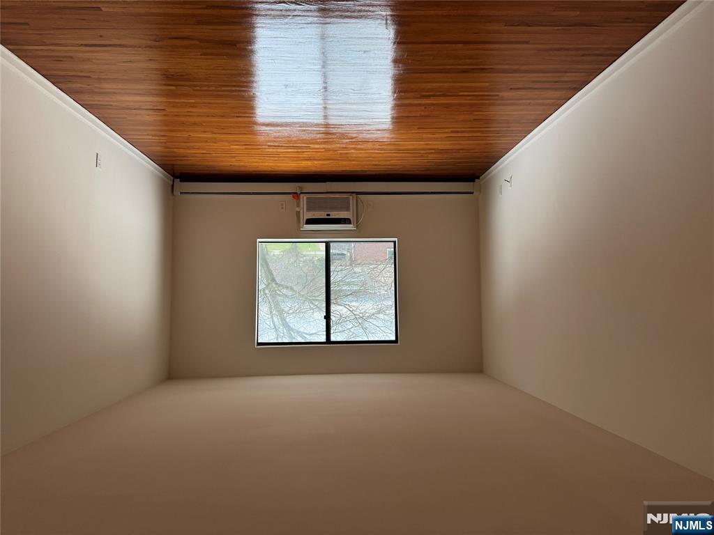 102 Bellgrove Drive, Unit 4A Mahwah, NJ 07430 - Photo 1 of 11 an empty room with wooden floor and windows