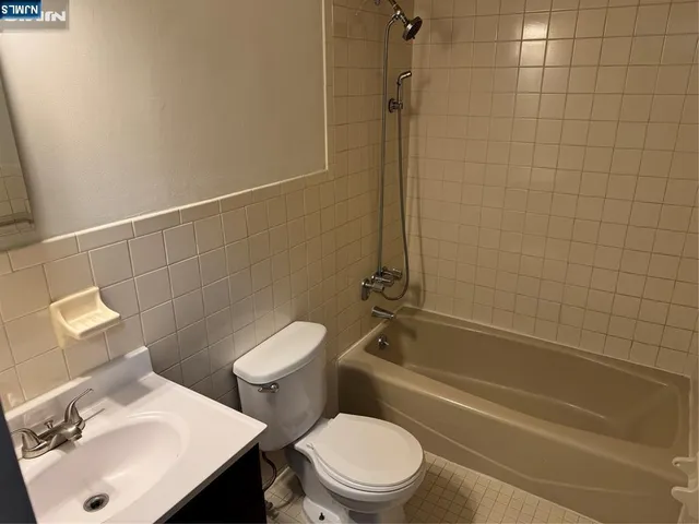 a bathroom with a sink a toilet and a bathtub