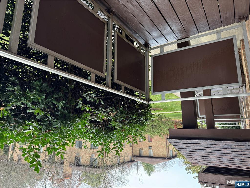 102 Bellgrove Drive, Unit 4A Mahwah, NJ 07430 - Photo 7 of 11 a view of balcony with wooden floor