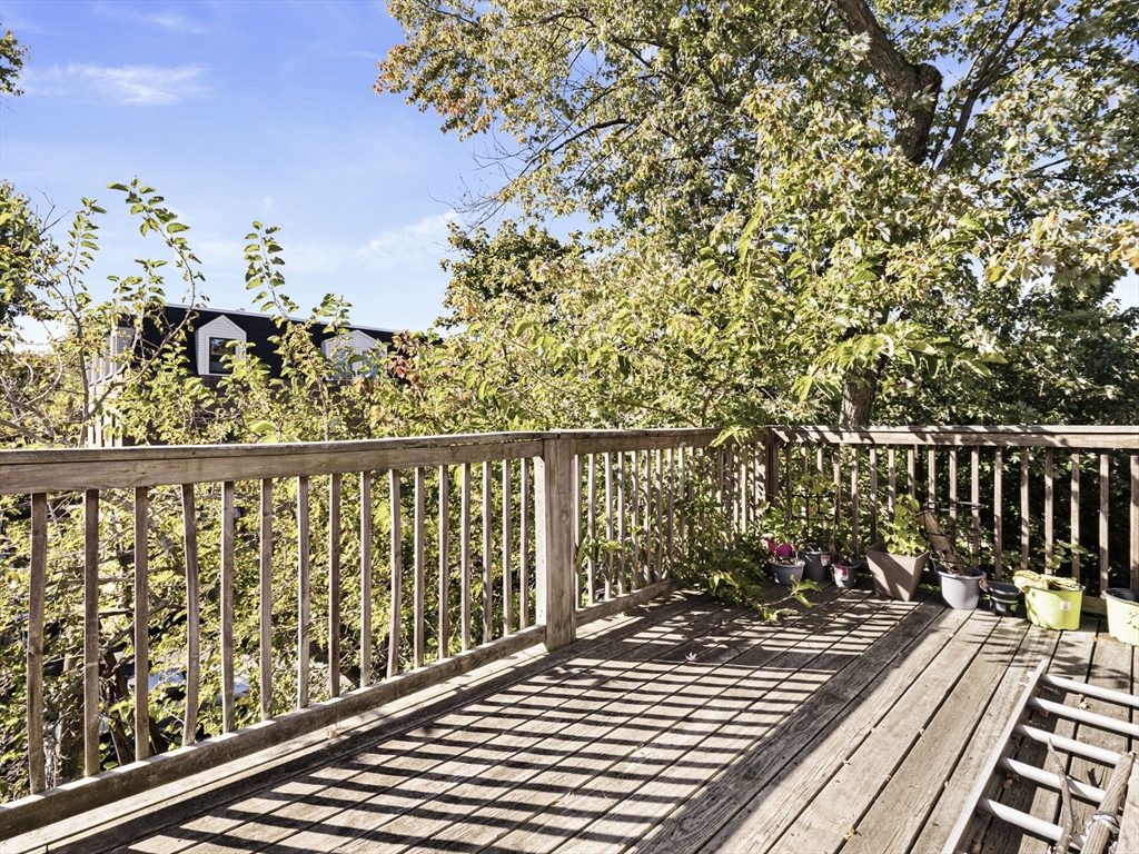 95 Florida Street, Unit 3 Boston, MA 02124 - Photo 22 of 29 a balcony with wooden floor and outdoor space