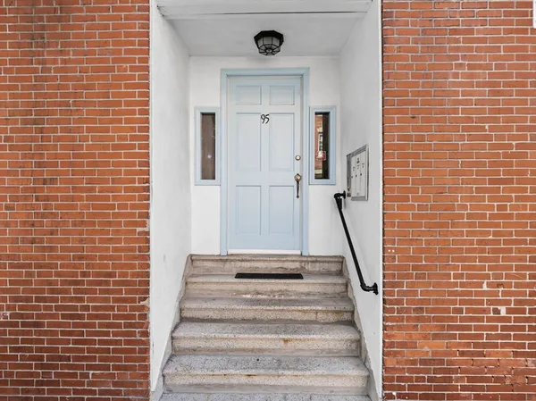 a view of a staircase with white walls