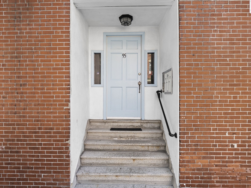 95 Florida Street, Unit 3 Boston, MA 02124 - Photo 26 of 29 a view of a staircase with white walls