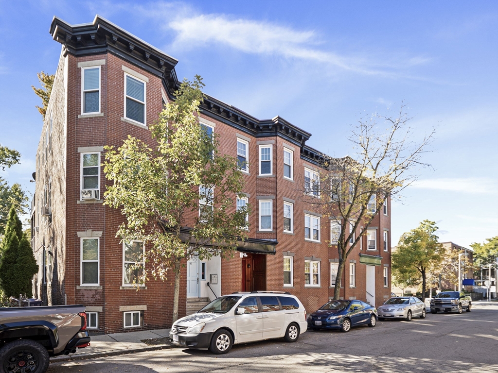 95 Florida Street, Unit 3 Boston, MA 02124 - Photo 28 of 29 a car parked in front of a building