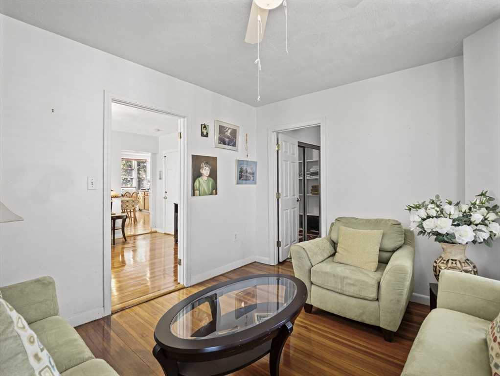 95 Florida Street, Unit 3 Boston, MA 02124 - Photo 4 of 29 a living room with furniture and a wooden floor