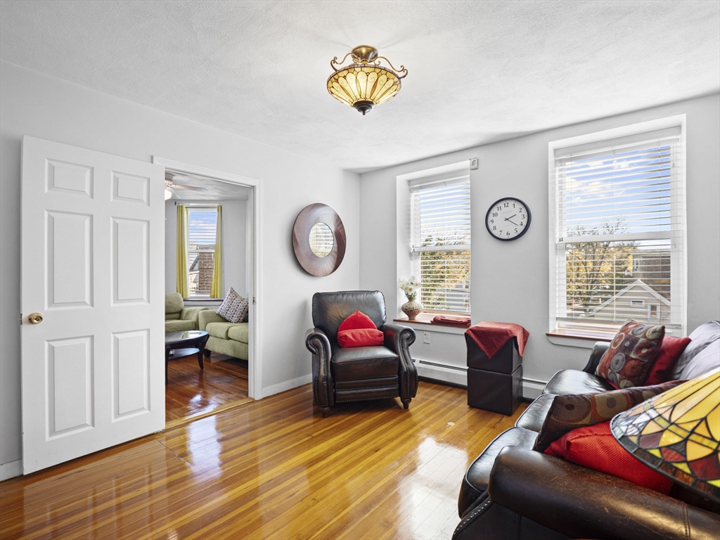 95 Florida Street, Unit 3 Boston, MA 02124 - Photo 8 of 29 a living room with furniture and a window