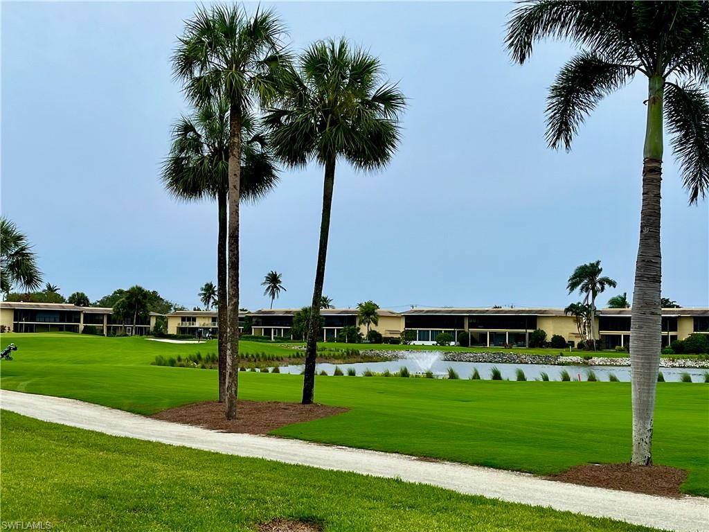 348 Tern Drive, Unit 4 Naples, FL 34112 - Photo 17 of 27 a view of a park with palm trees