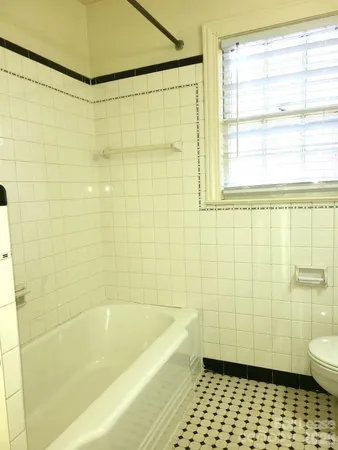 a bathroom with a shower and a toilet