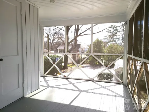 a view of a room that has a window and outside view