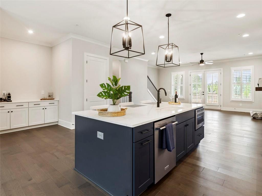 355 Chiswick Circle Alpharetta, GA 30009 - Photo 20 of 57 a kitchen with stainless steel appliances granite countertop a sink and a stove