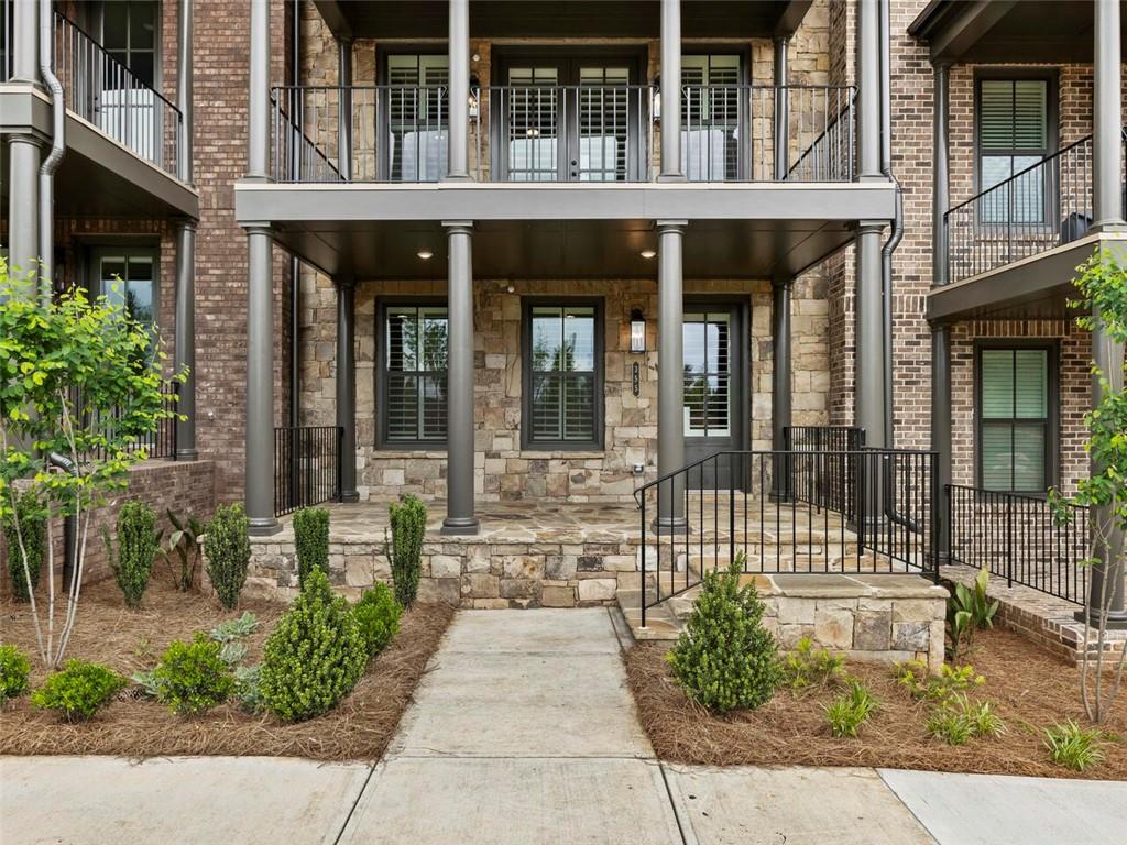 355 Chiswick Circle Alpharetta, GA 30009 - Photo 2 of 57 a front view of a building with a outdoor shower