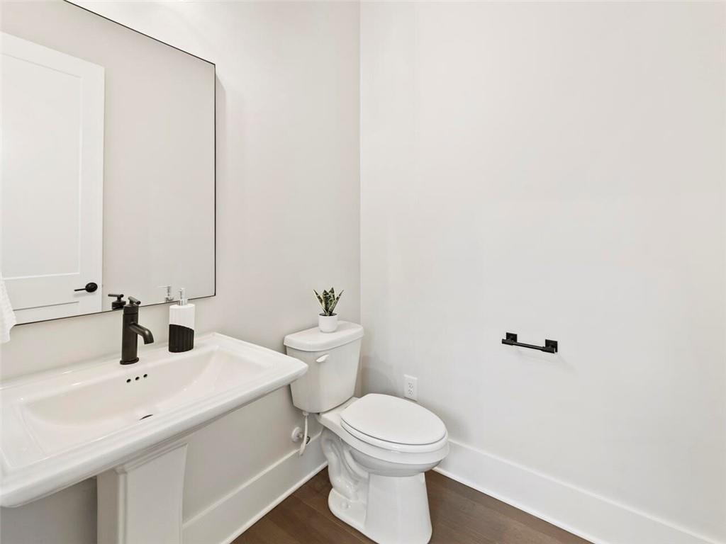 355 Chiswick Circle Alpharetta, GA 30009 - Photo 22 of 57 a bathroom with a toilet sink and mirror