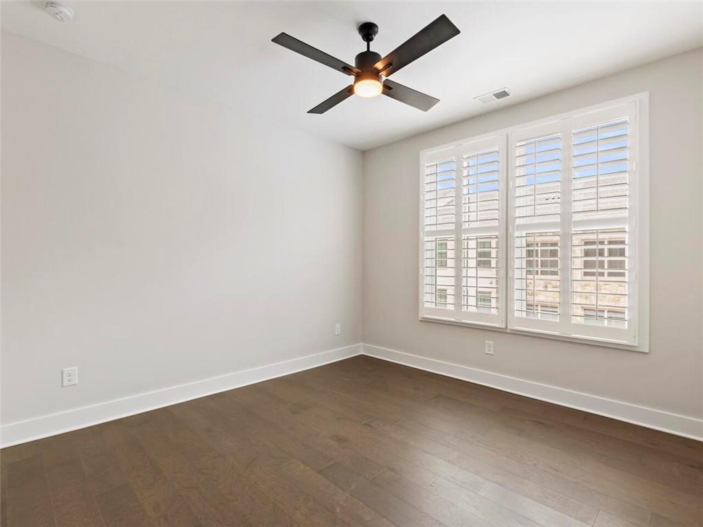 355 Chiswick Circle Alpharetta, GA 30009 - Photo 28 of 57 an empty room with a window and a fan