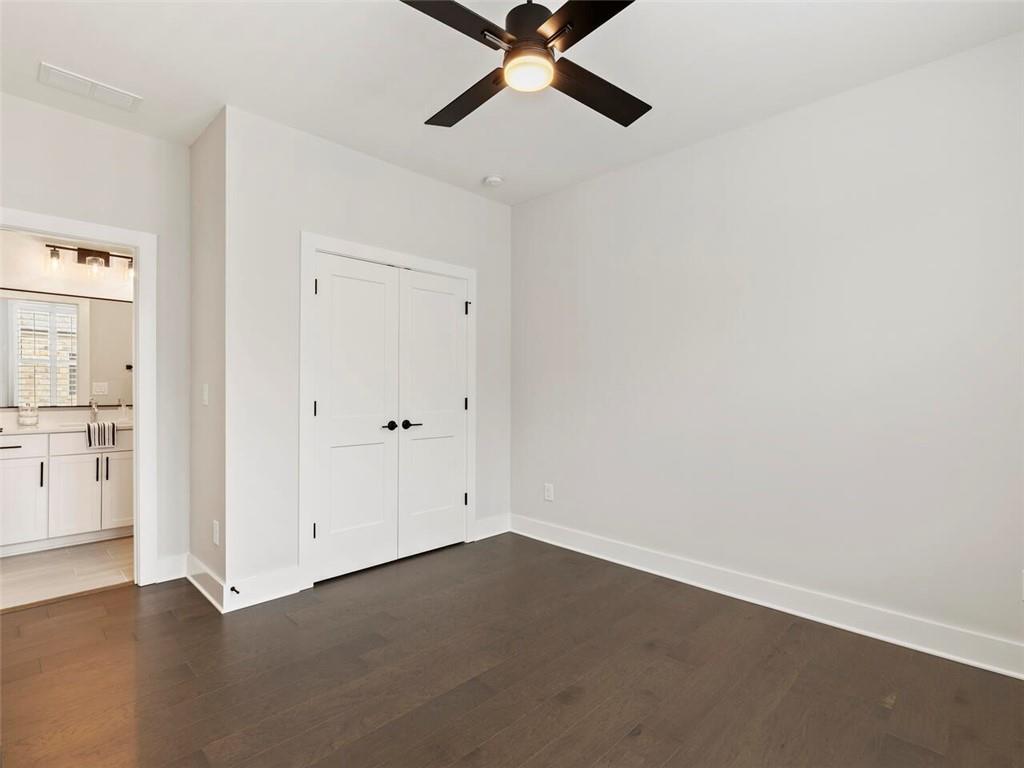 355 Chiswick Circle Alpharetta, GA 30009 - Photo 29 of 57 an empty room with a ceiling fan and carpet