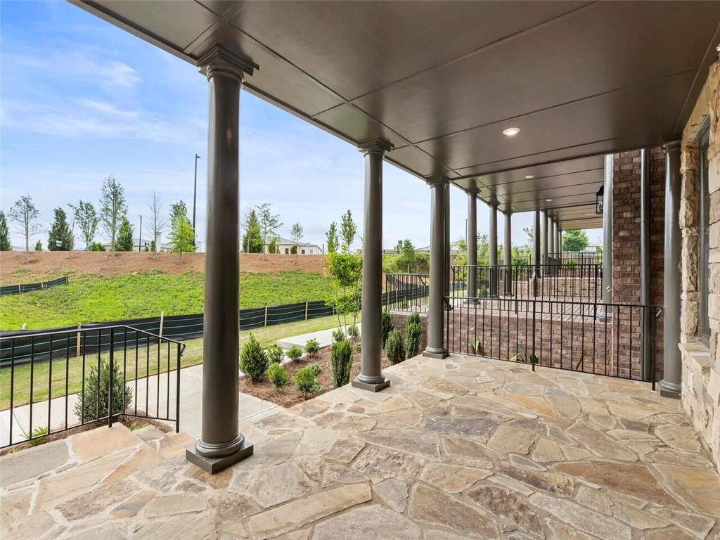 355 Chiswick Circle Alpharetta, GA 30009 - Photo 3 of 57 a view of a porch with a floor to ceiling window next to a yard
