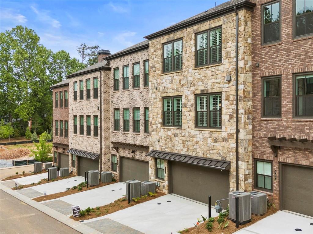 355 Chiswick Circle Alpharetta, GA 30009 - Photo 34 of 57 a view of a building with a yard
