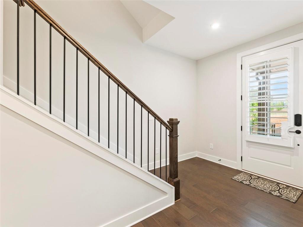 355 Chiswick Circle Alpharetta, GA 30009 - Photo 4 of 57 a view of staircase with wooden floor and a window