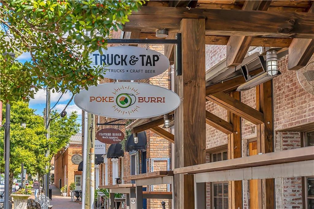 355 Chiswick Circle Alpharetta, GA 30009 - Photo 55 of 57 a view of a street with stores