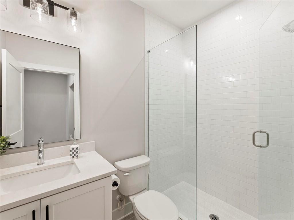 355 Chiswick Circle Alpharetta, GA 30009 - Photo 6 of 57 a bathroom with a sink toilet and shower