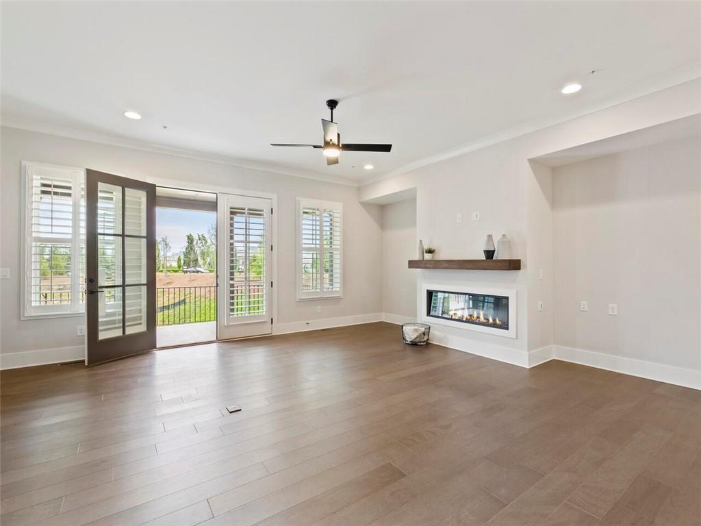 355 Chiswick Circle Alpharetta, GA 30009 - Photo 10 of 57 a view of an empty room with a window and wooden floor