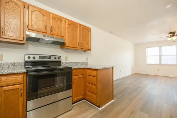 a kitchen with a sink and a window