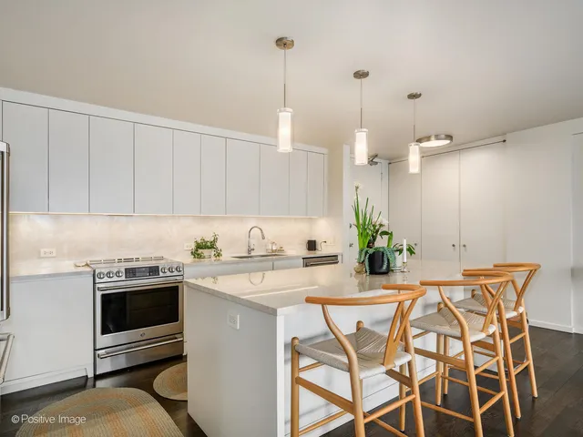 a kitchen with a table and chairs in it