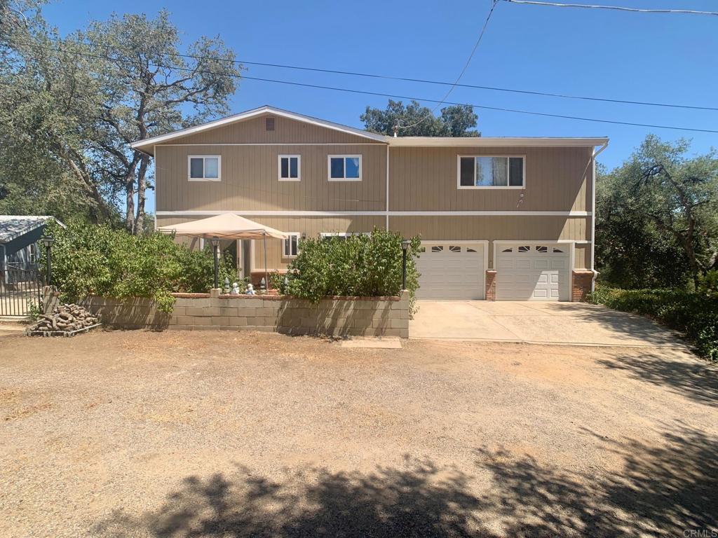 9678 Garwood Road Descanso, CA 91916 - Photo 1 of 1 a front view of a house with a yard and a garage